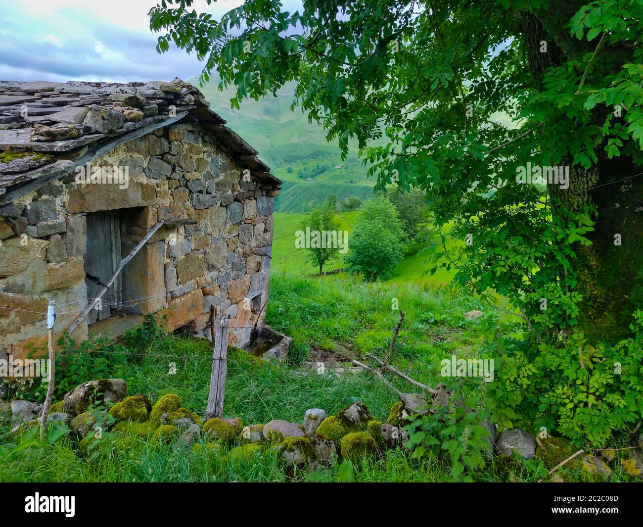 Spring landscape of pasiegas cabins and meadows in the Miera Valley in the Autonomous Community of Cantabria. Spain, Europe Stock Photo