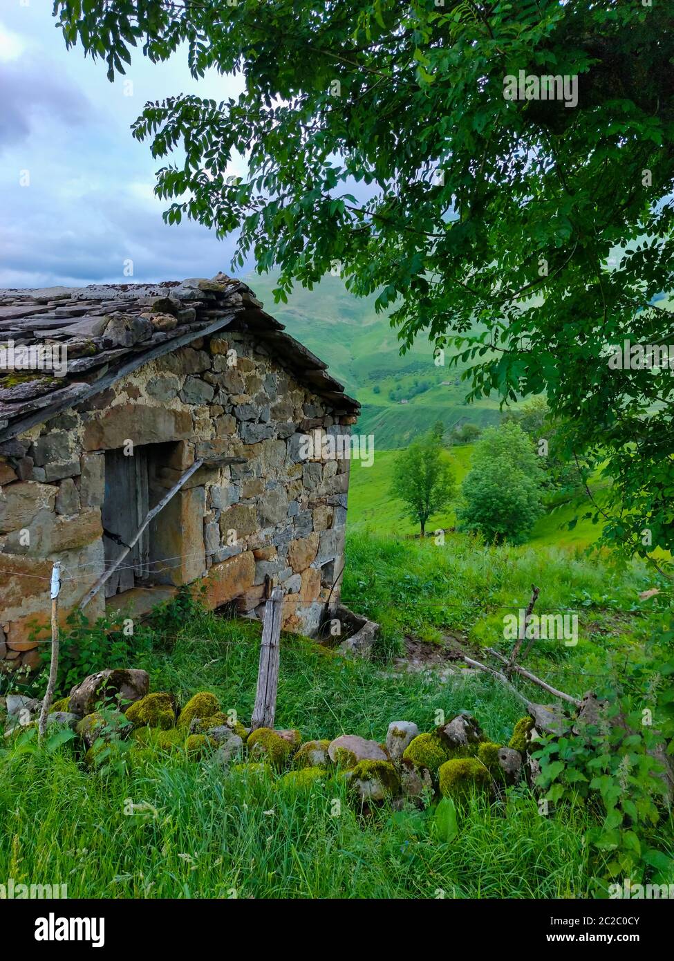 Spring landscape of pasiegas cabins and meadows in the Miera Valley in the Autonomous Community of Cantabria. Spain, Europe Stock Photo