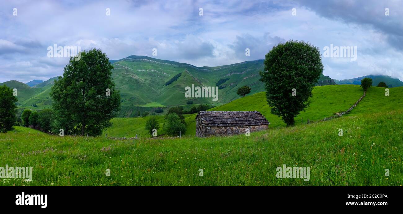 Spring landscape of pasiegas cabins and meadows in the Miera Valley in the Autonomous Community of Cantabria. Spain, Europe Stock Photo