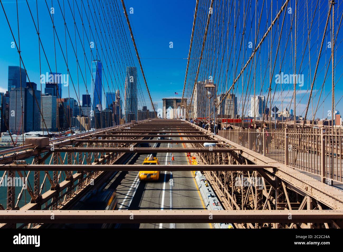 Spring April 2015 Brooklyn Bridge Traffic with yellow cab and people, New York United States Stock Photo