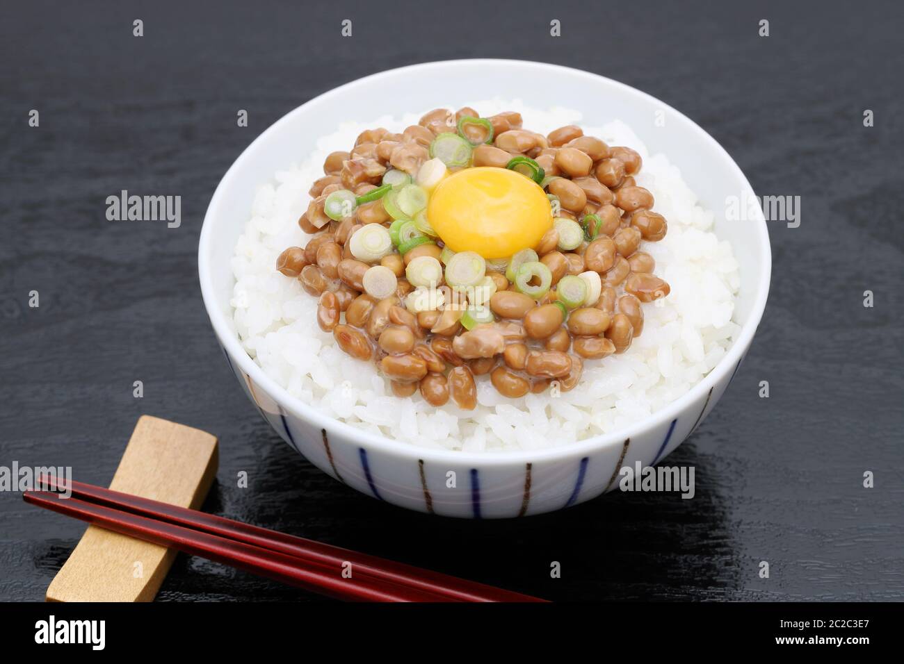Japanes food, cooked white rice with natto on white background Stock Photo