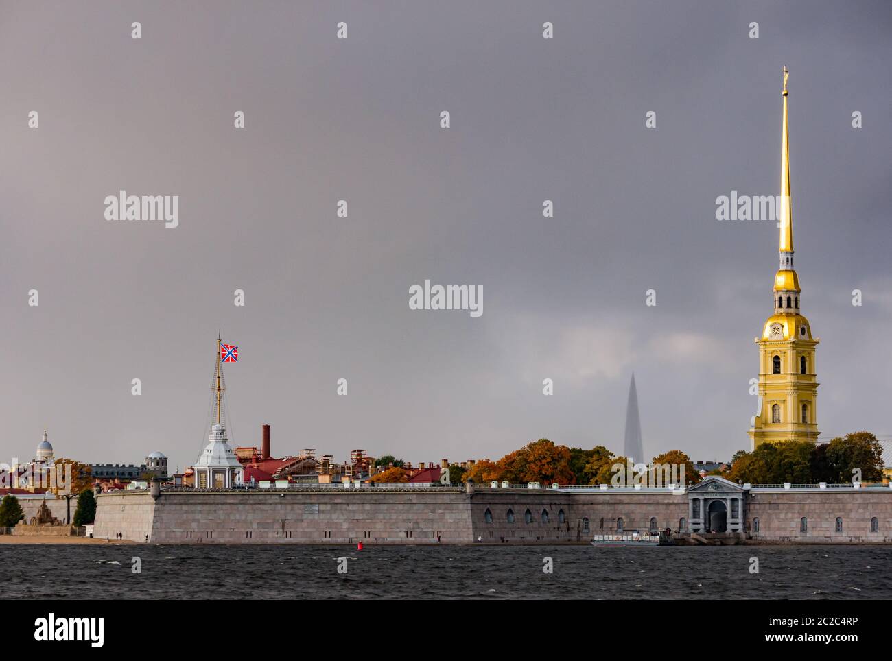 Peter and Paul Cathedral spire, Peter and Paul Fortress on Neva River with stormy sky, St Petersburg, Russia Stock Photo