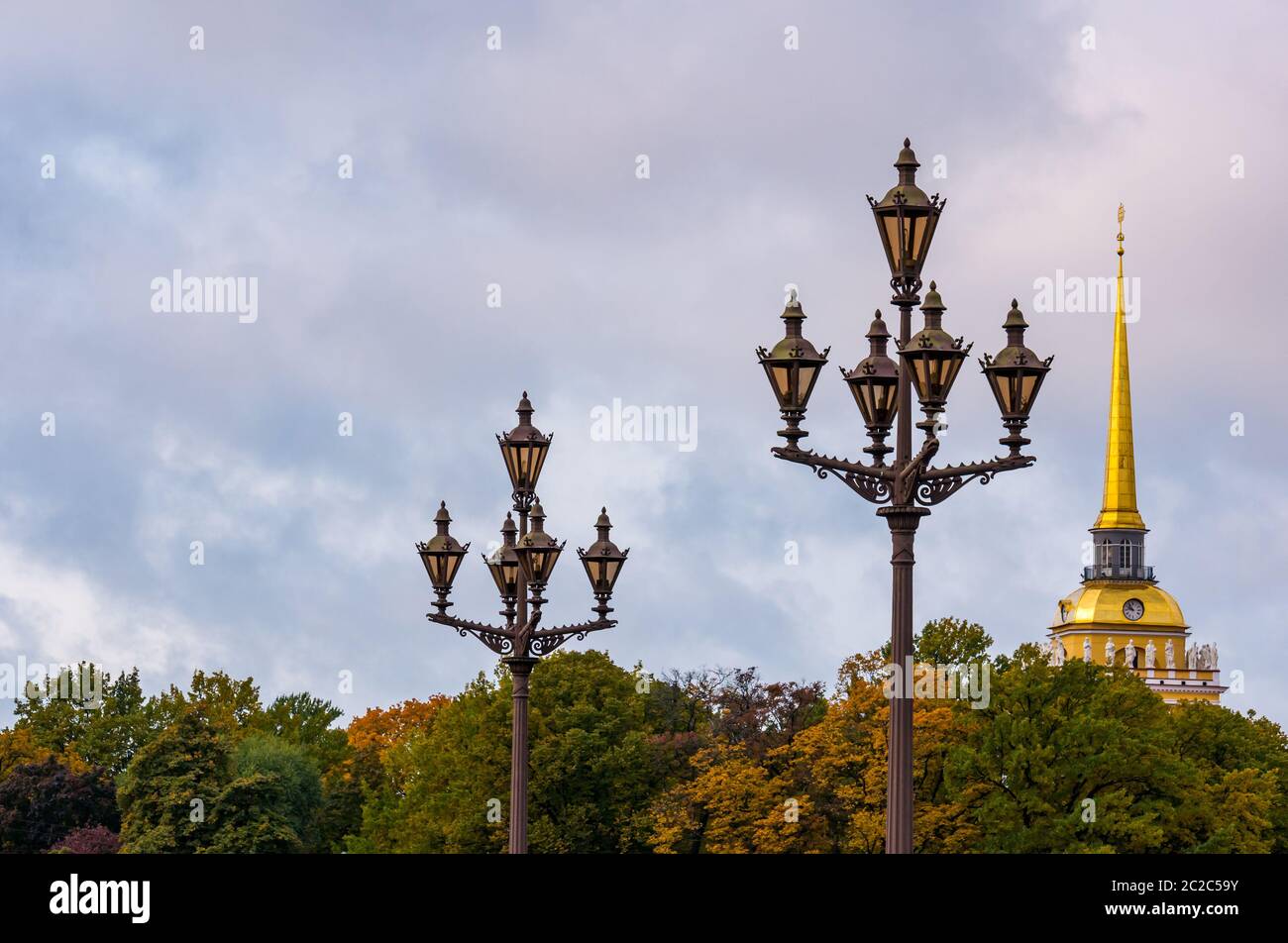 Ornate old fashioned streetlights and spire of Admiralty Building in Autumn, St Petersburg, Russia Stock Photo