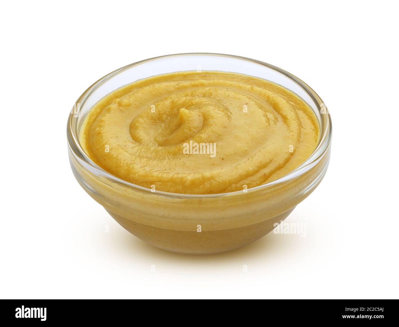 Mustard sauce in bowl isolated on white background Stock Photo - Alamy