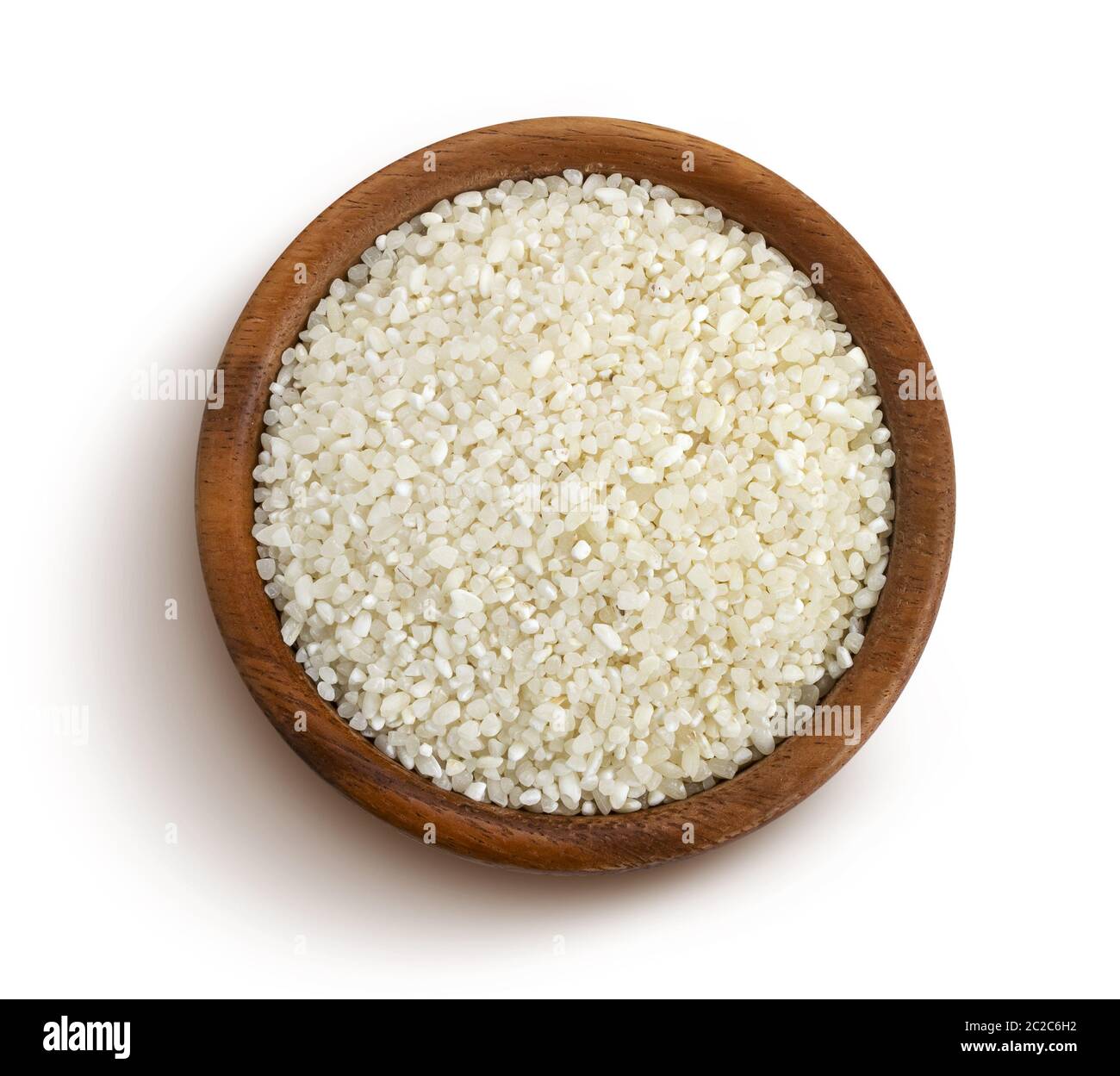 Crushed rice in wooden bowl isolated on white background Stock Photo ...