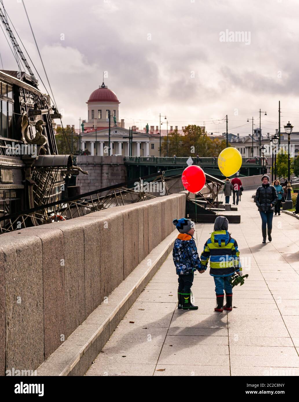 Children with balloons by historic sailing ship, Kronverkskaya Embankment, St Petersburg, Russia Stock Photo