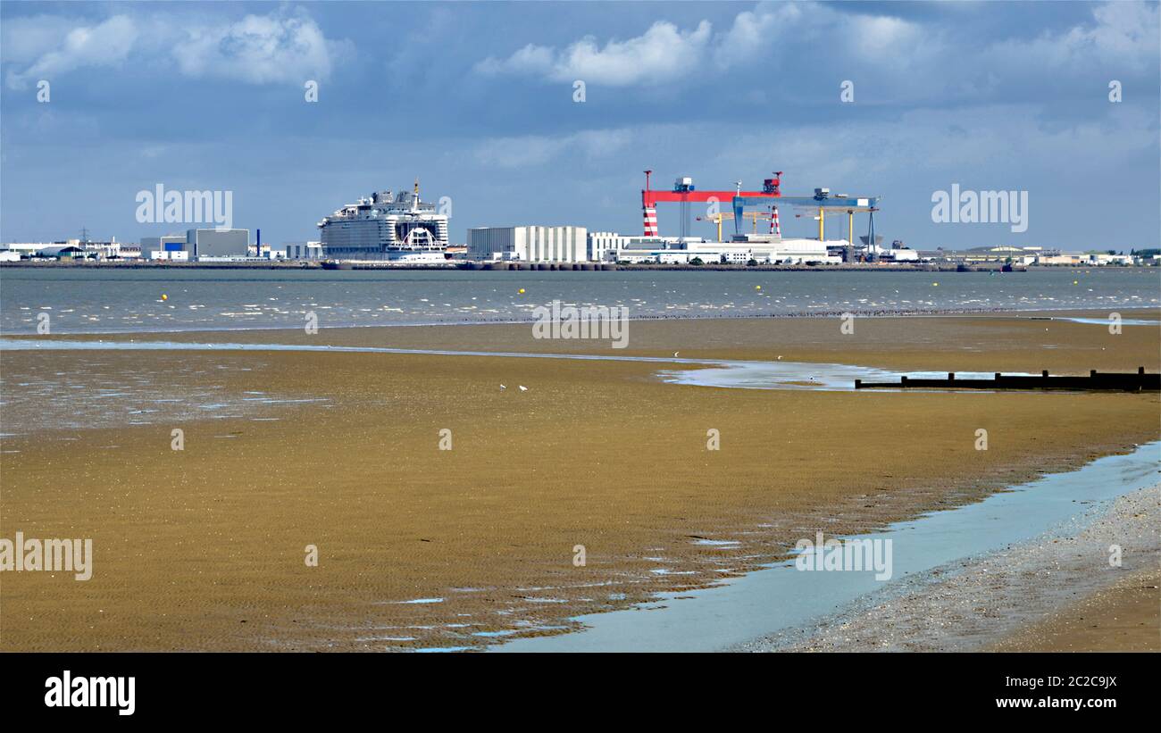 noramic photo of harbor of Saint Nazaire seen from beach of Saint Brevin in France. Saint Nazaire is a commune in the Loire-Atlantique in France Stock Photo
