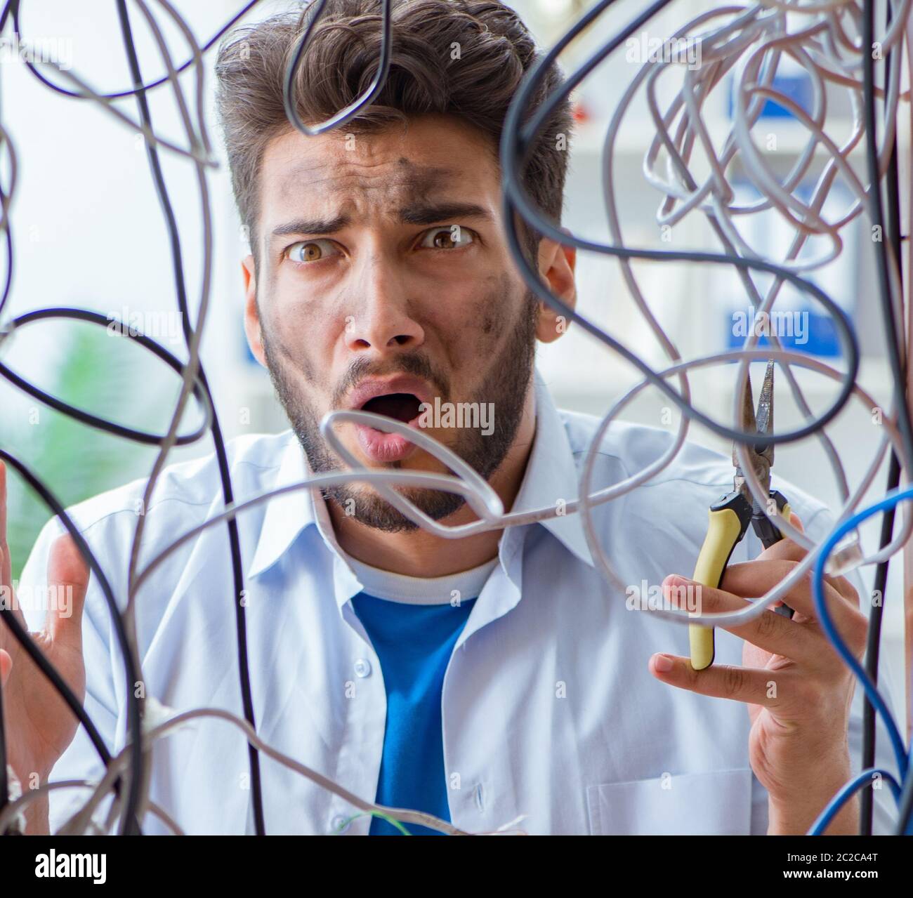 Computer repairman working on repairing network in IT Stock