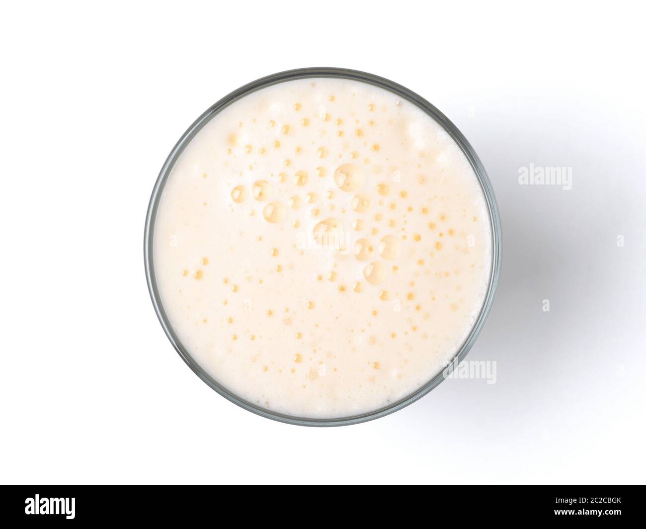 Vanilla milkshake with foam isolated on white Stock Photo