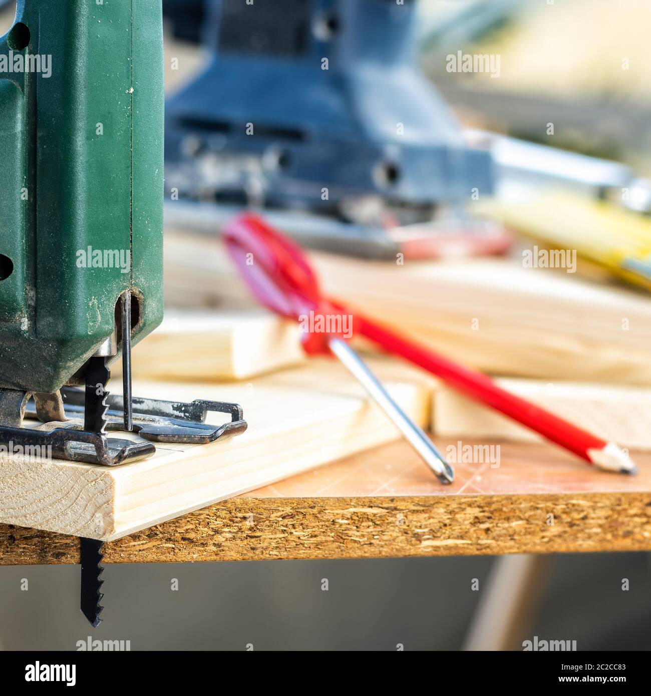Professional woodworking tools, manual electric saw for cutting wood. Housework do it yourself. Stock photography. Stock Photo