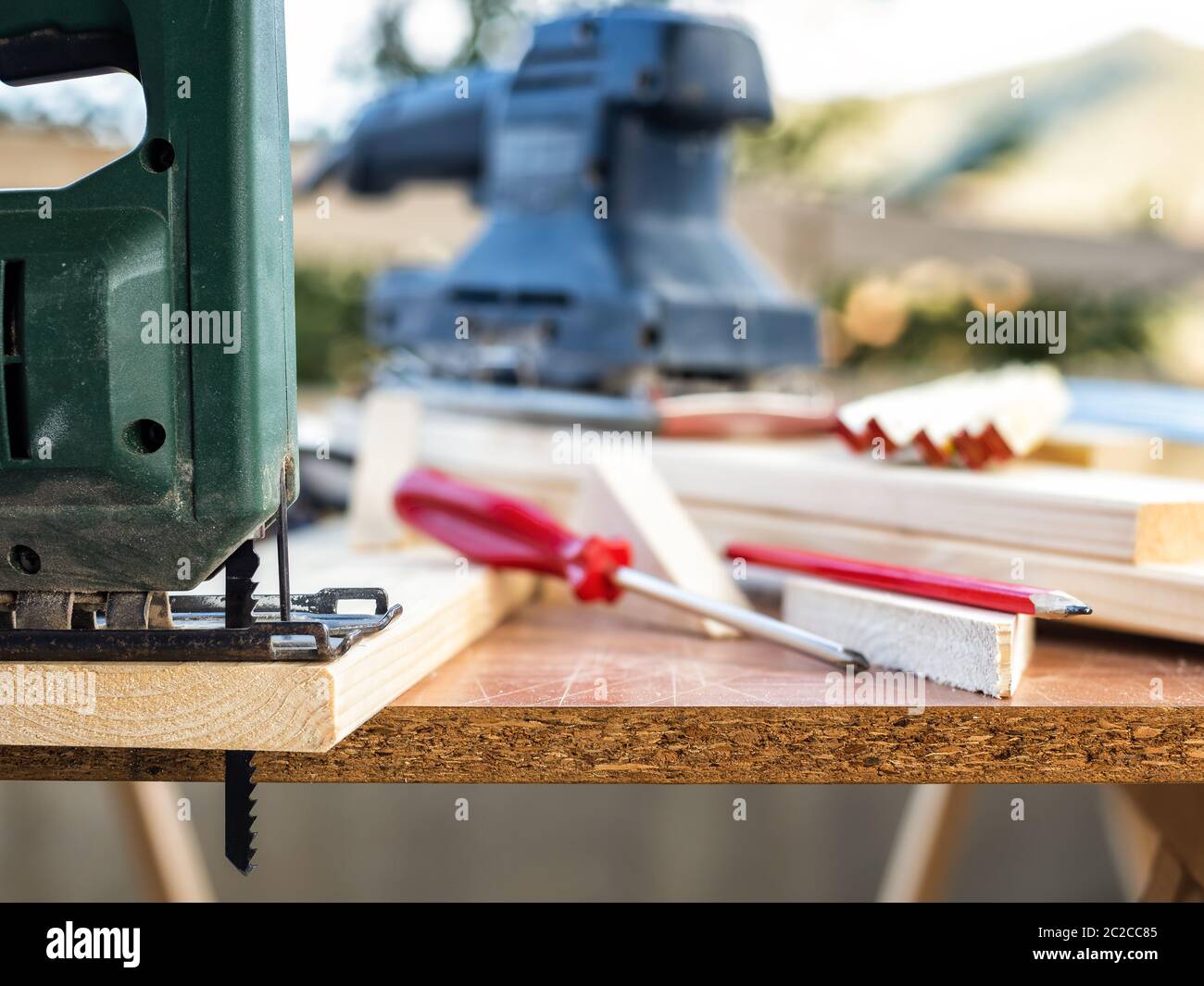 Professional woodworking tools, manual electric saw for cutting wood. Housework do it yourself. Stock photography. Stock Photo