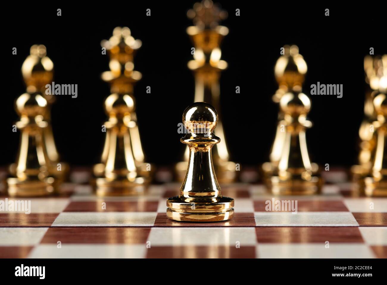 Golden chess figures standing on chessboard Stock Photo - Alamy