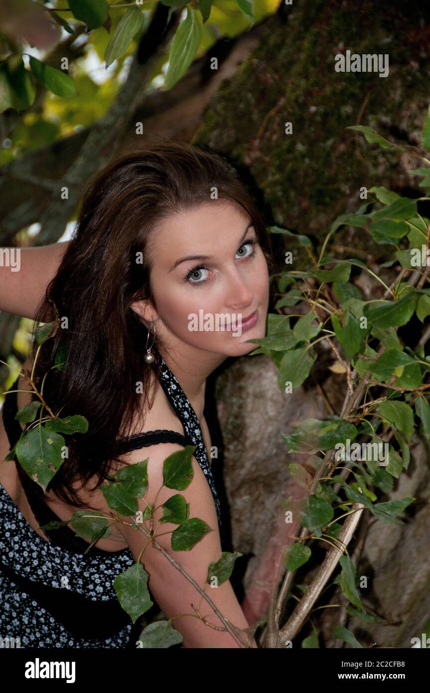 Girl beside a tree Stock Photo