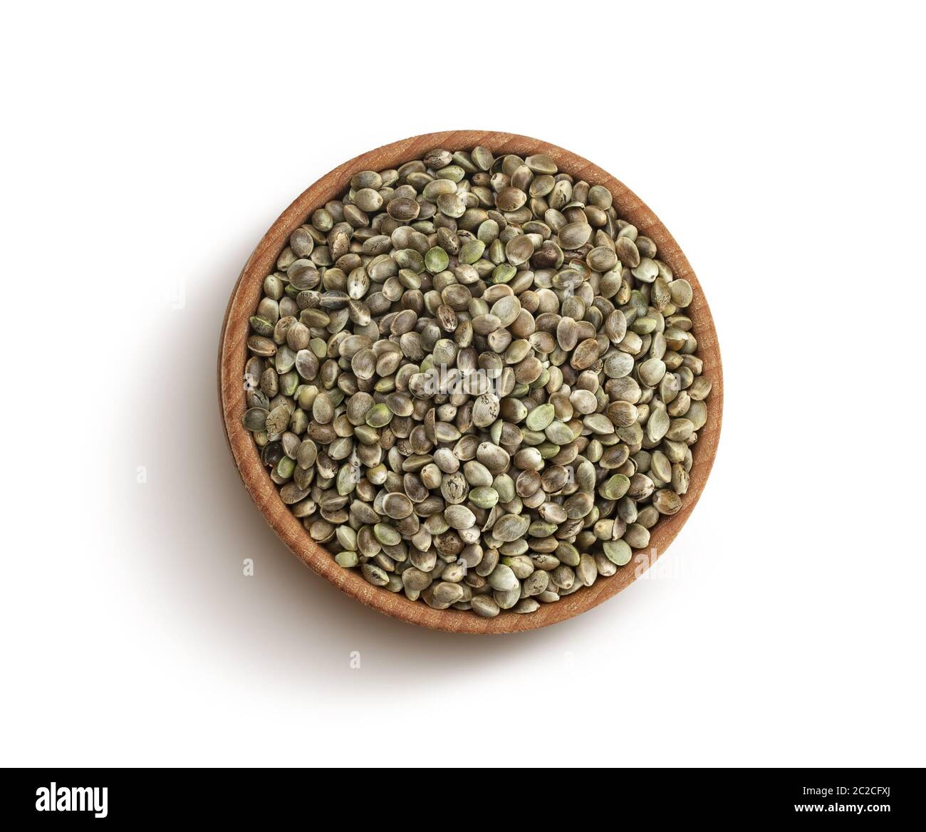 Hemp seeds in wooden bowl isolated on white background, top view, close ...