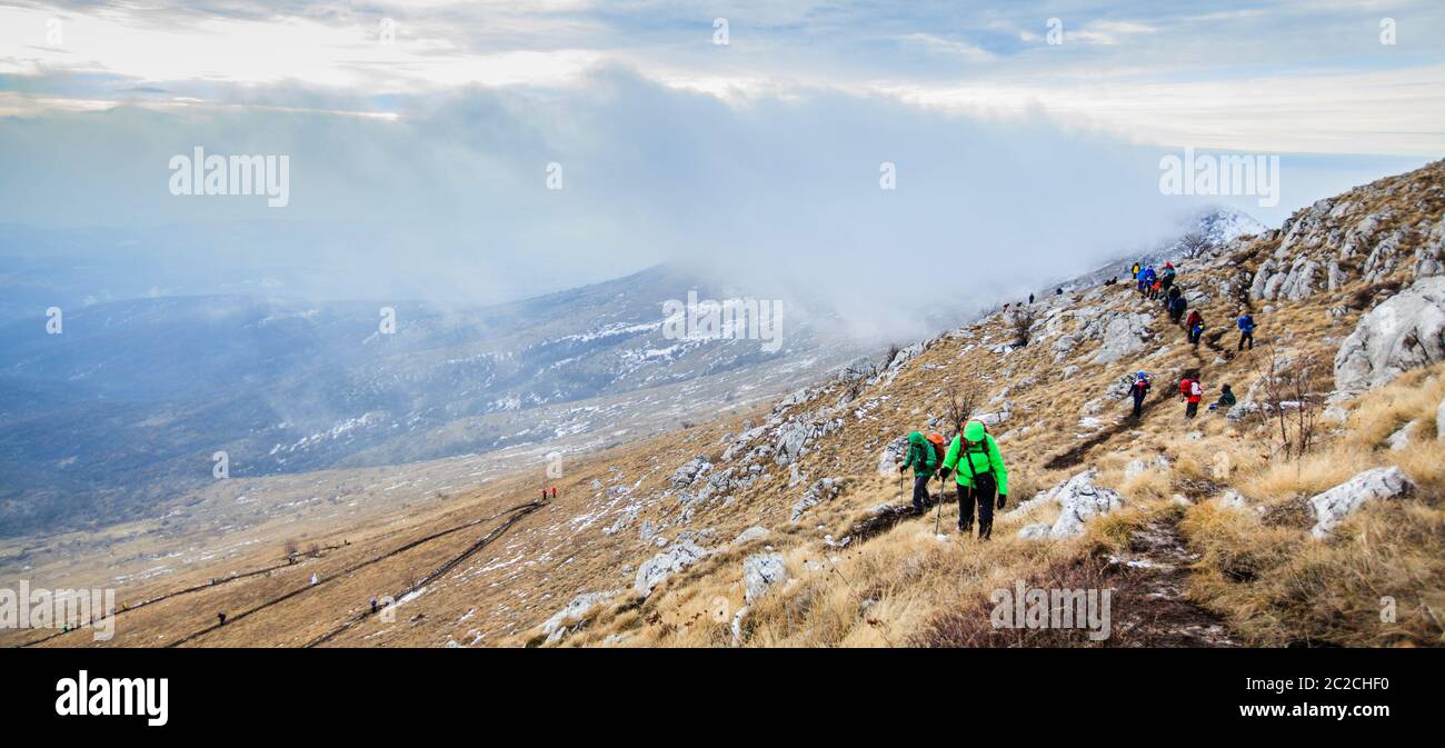 Group Of Mountaineers Trekking Winter Mountain Landscape Hiking Healthy Activity Stock Photo