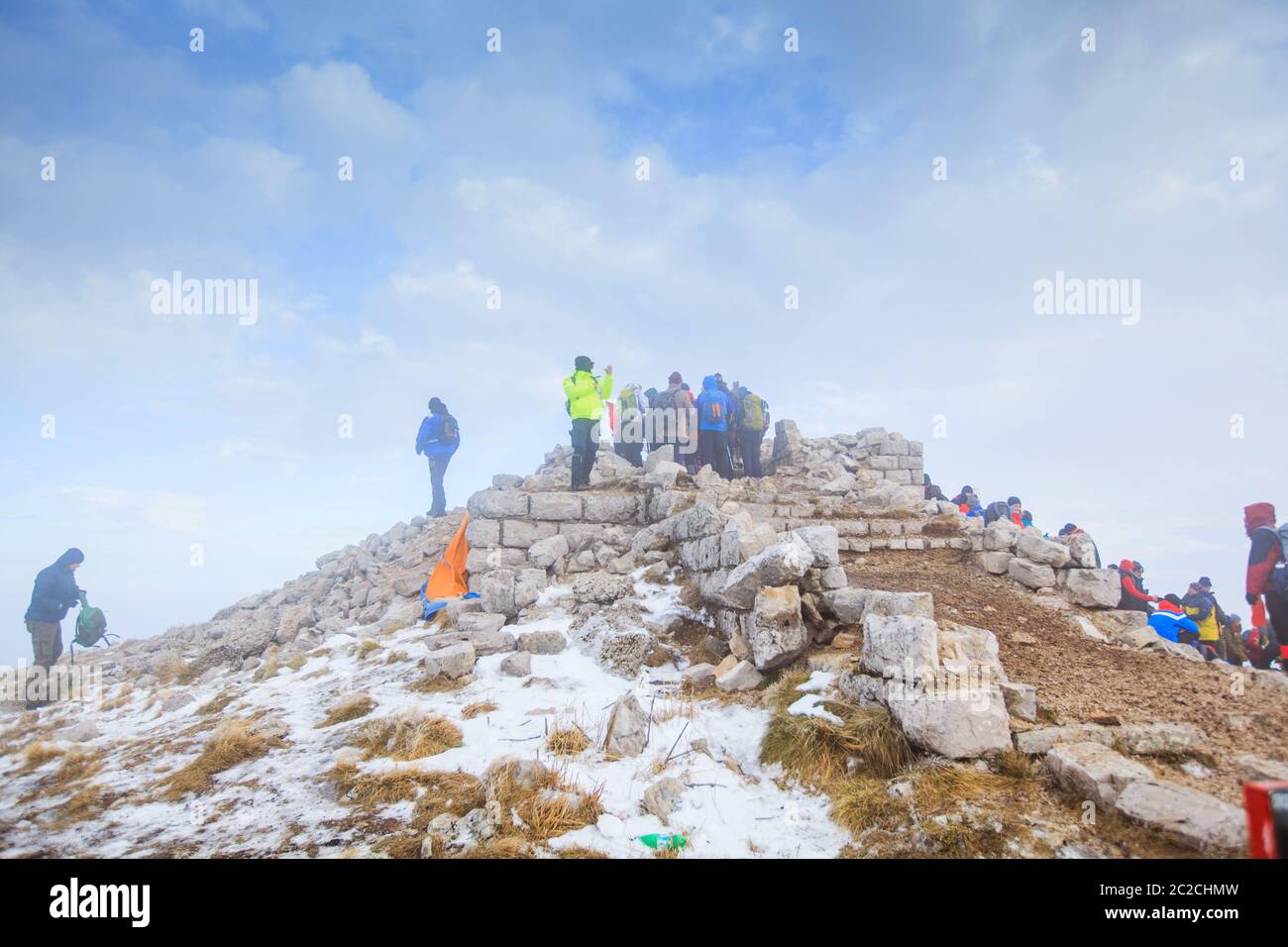 Group Of Mountaineers on peak Rtanj, Serbia. Winter Mountain Landscape Hiking Healthy Activity Stock Photo