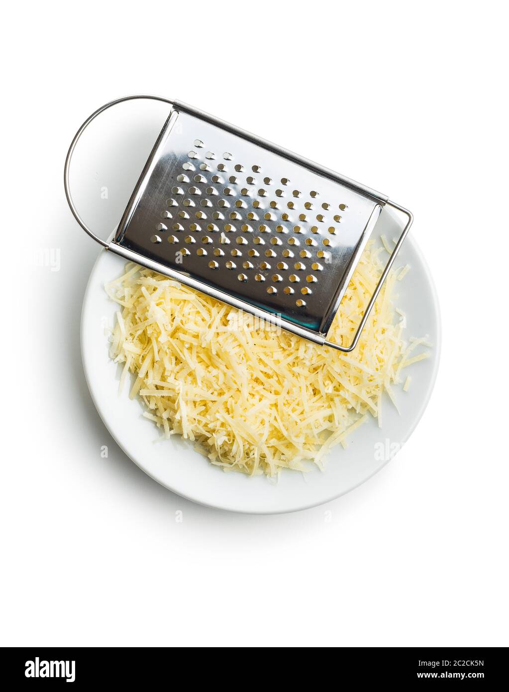 Tasty grated cheese and grater. Parmesan cheese isolated on white