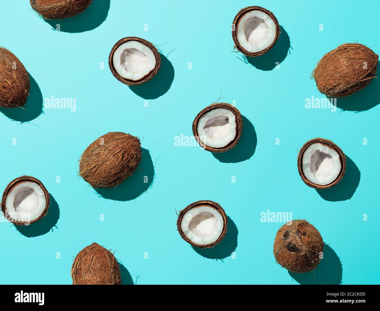 Coconuts half on blue background Stock Photo