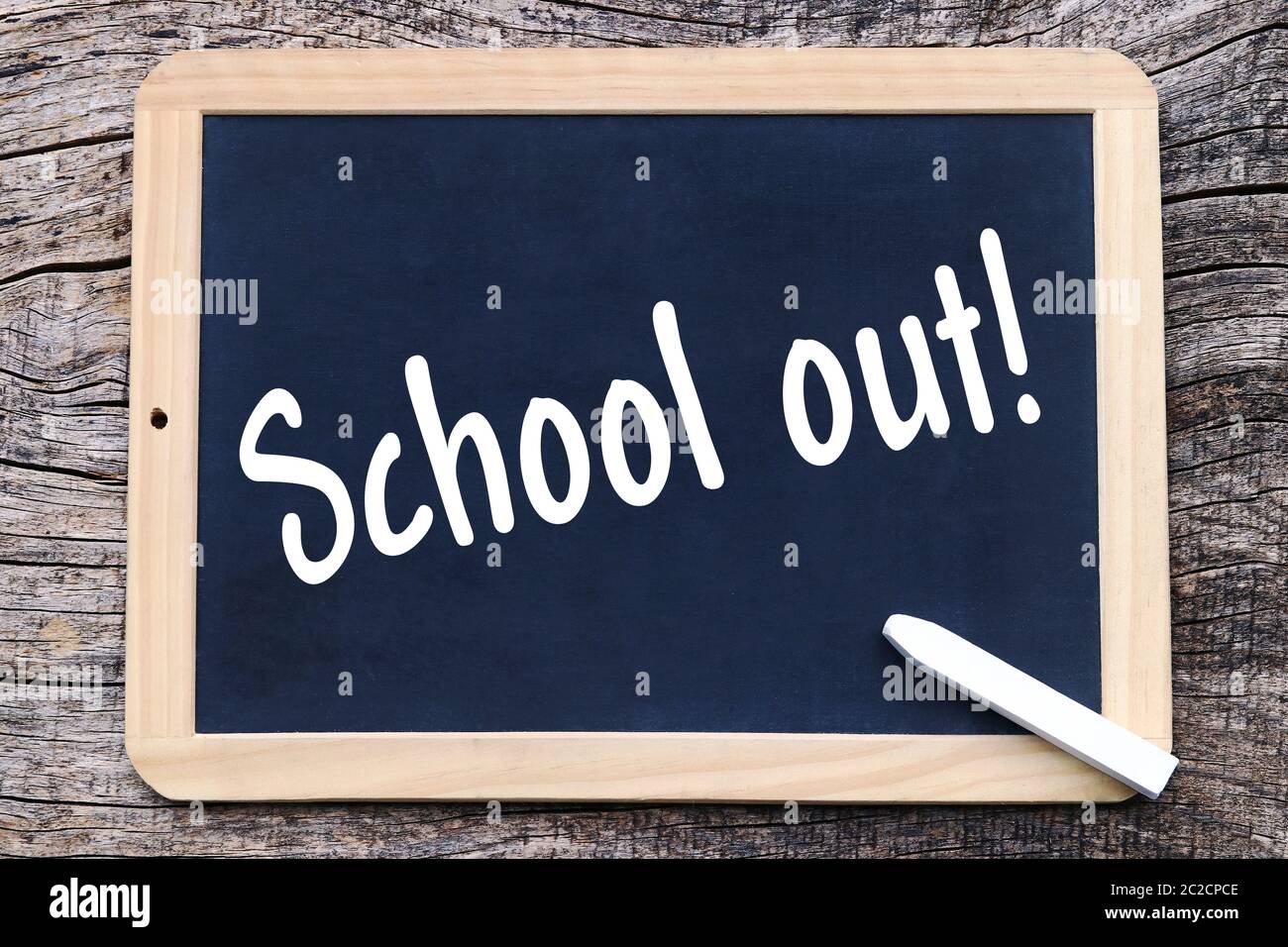 On a blackboard is written with chalk School out! Stock Photo Alamy