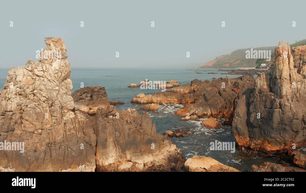 Aerial view rocks and stones on the Arambol beach in North Goa, India ...