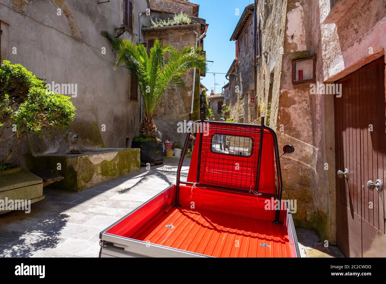 a small truck on the street of an old Italian town Stock Photo