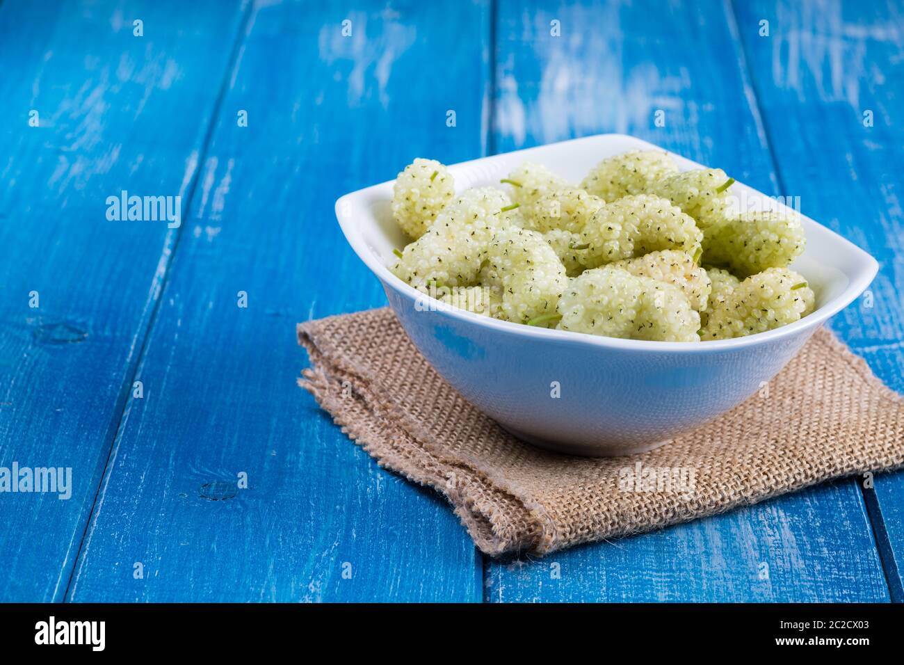 White mulberry on rustic board Stock Photo