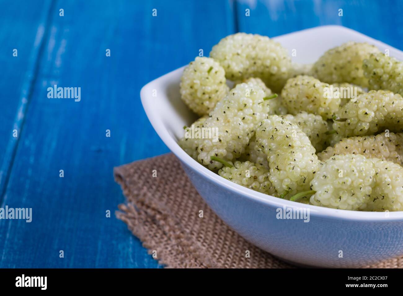 White mulberry on rustic board Stock Photo