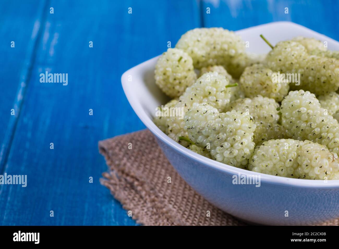 White mulberry on rustic board Stock Photo