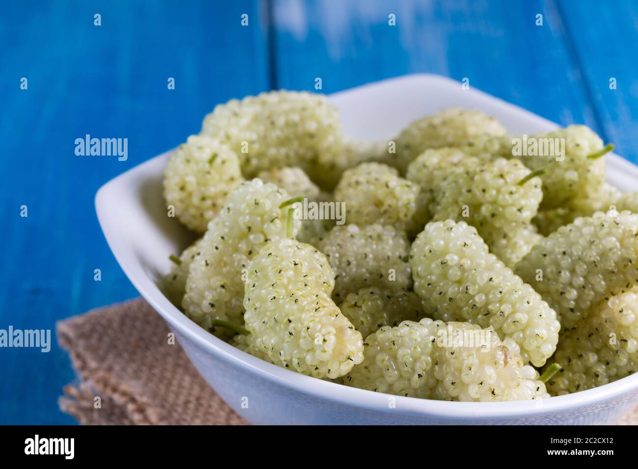 White mulberry on rustic board Stock Photo