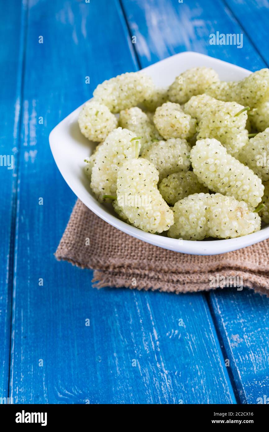 White mulberry on rustic board Stock Photo