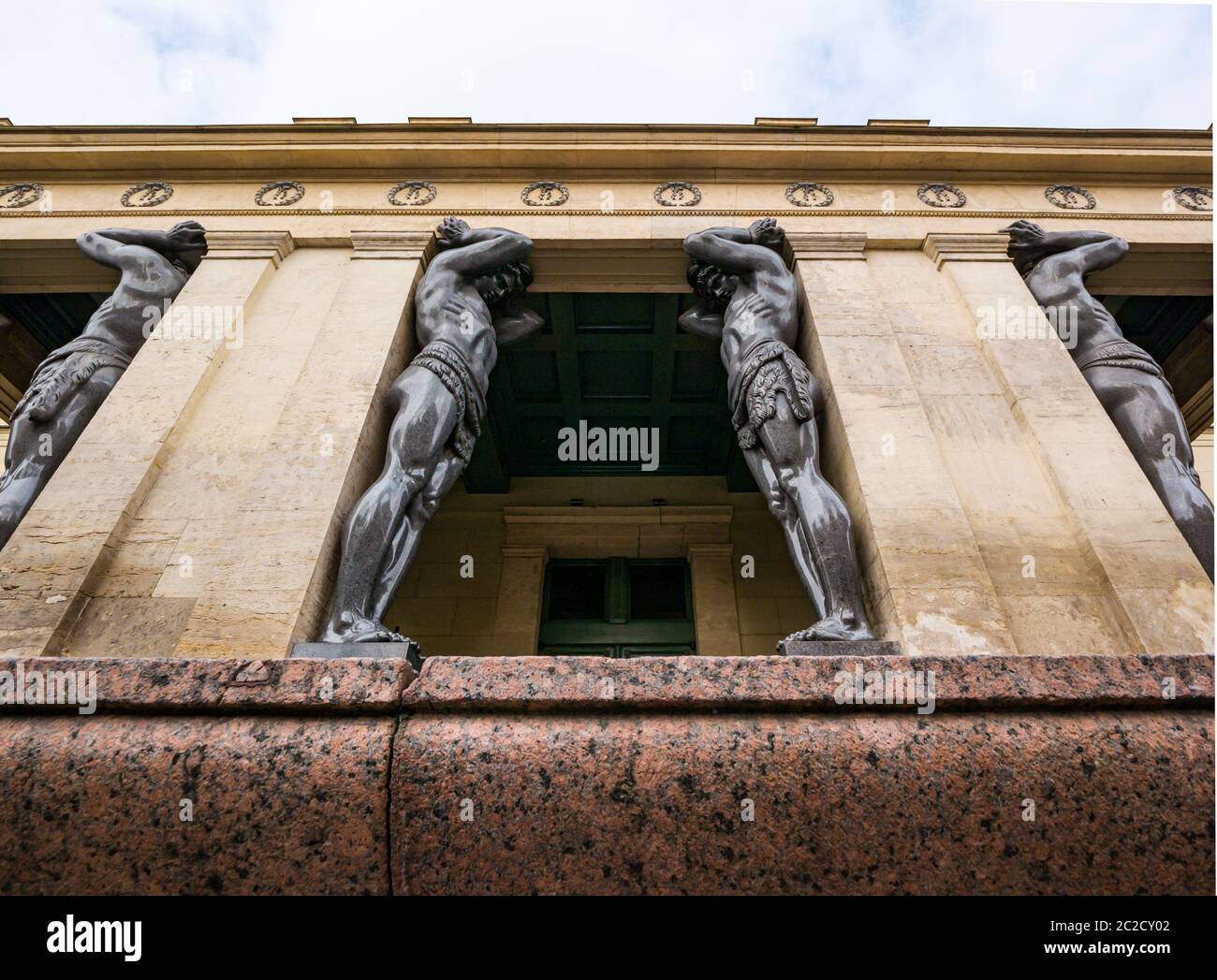 Giant Atlantis statues pillar supports on colonnade, Winter Palace, The Hermitage, St Petersburg, Russia Stock Photo