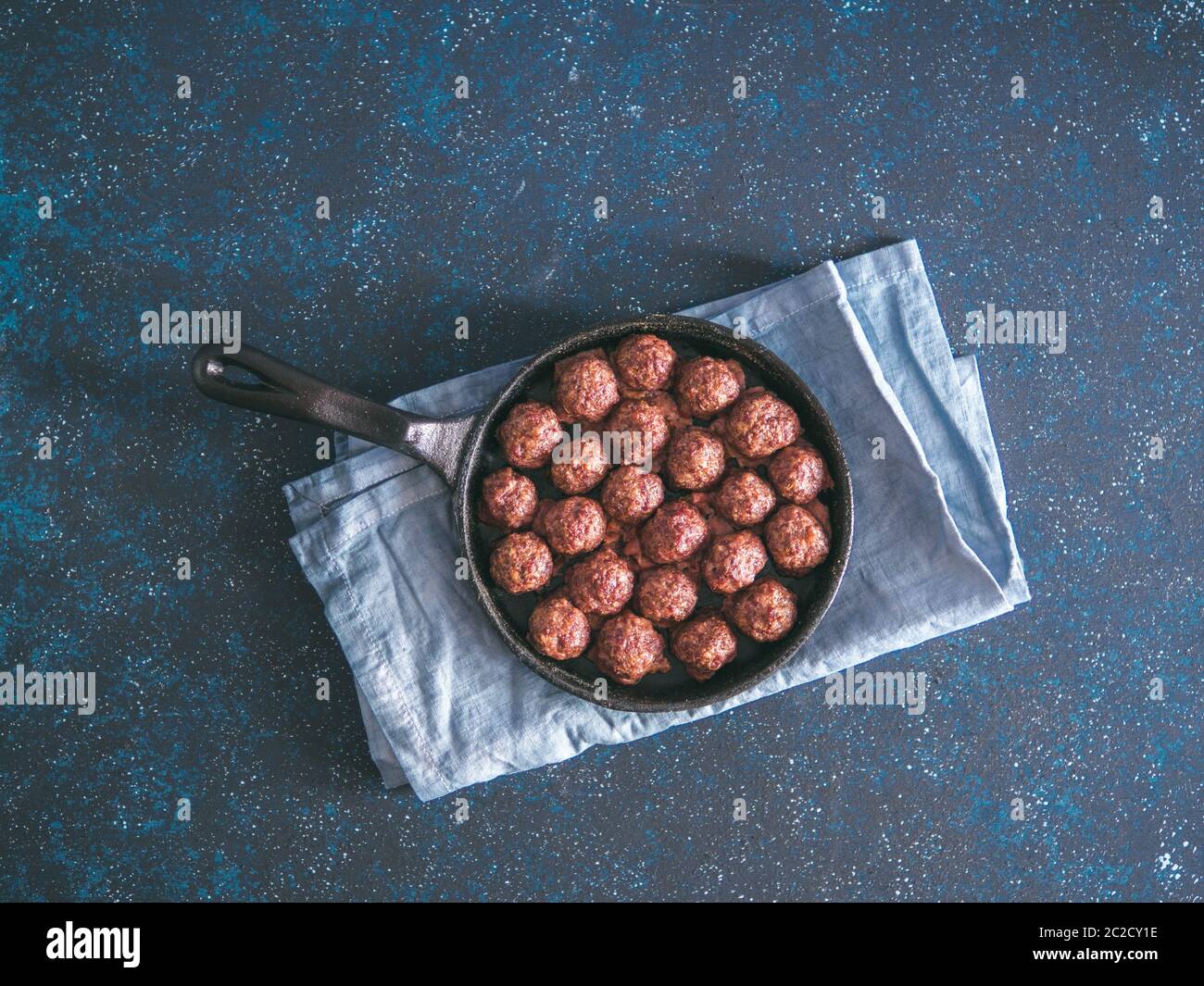 Homemade beef meatballs in castiron skillet Stock Photo Alamy