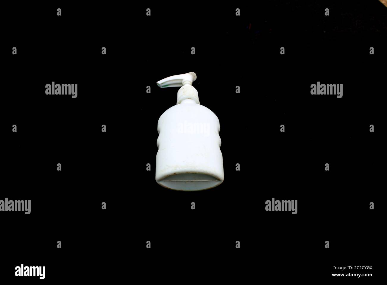 white color hand wash plastic bottle isolated on black background Stock