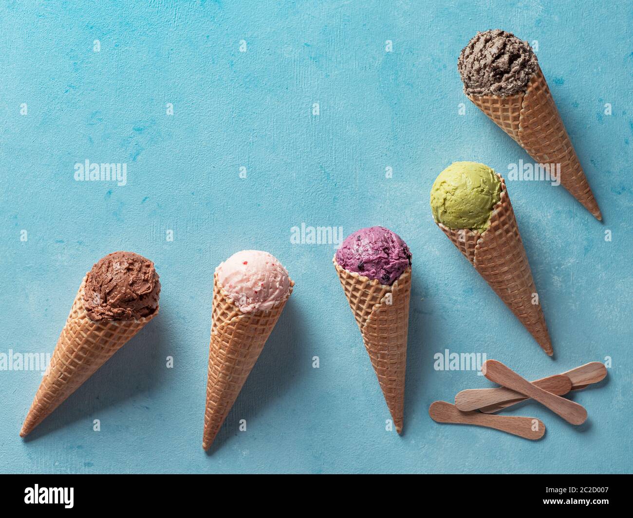 ice cream scoops in cones with copy space on blue Stock Photo - Alamy