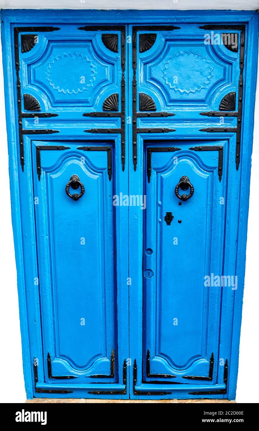 A blue wooden door with black ornaments in Frigillana white village. Andalusia, Costa del Sol, Spain Stock Photo