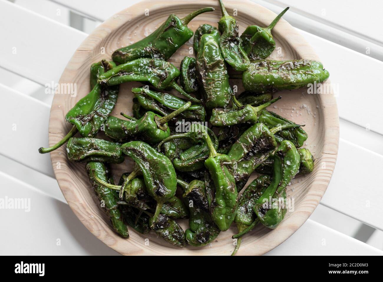 pimientos padron grilled spanish green chilli peppers tapas snack on plate  in rustic santiago de compostela restaurant Stock Photo - Alamy