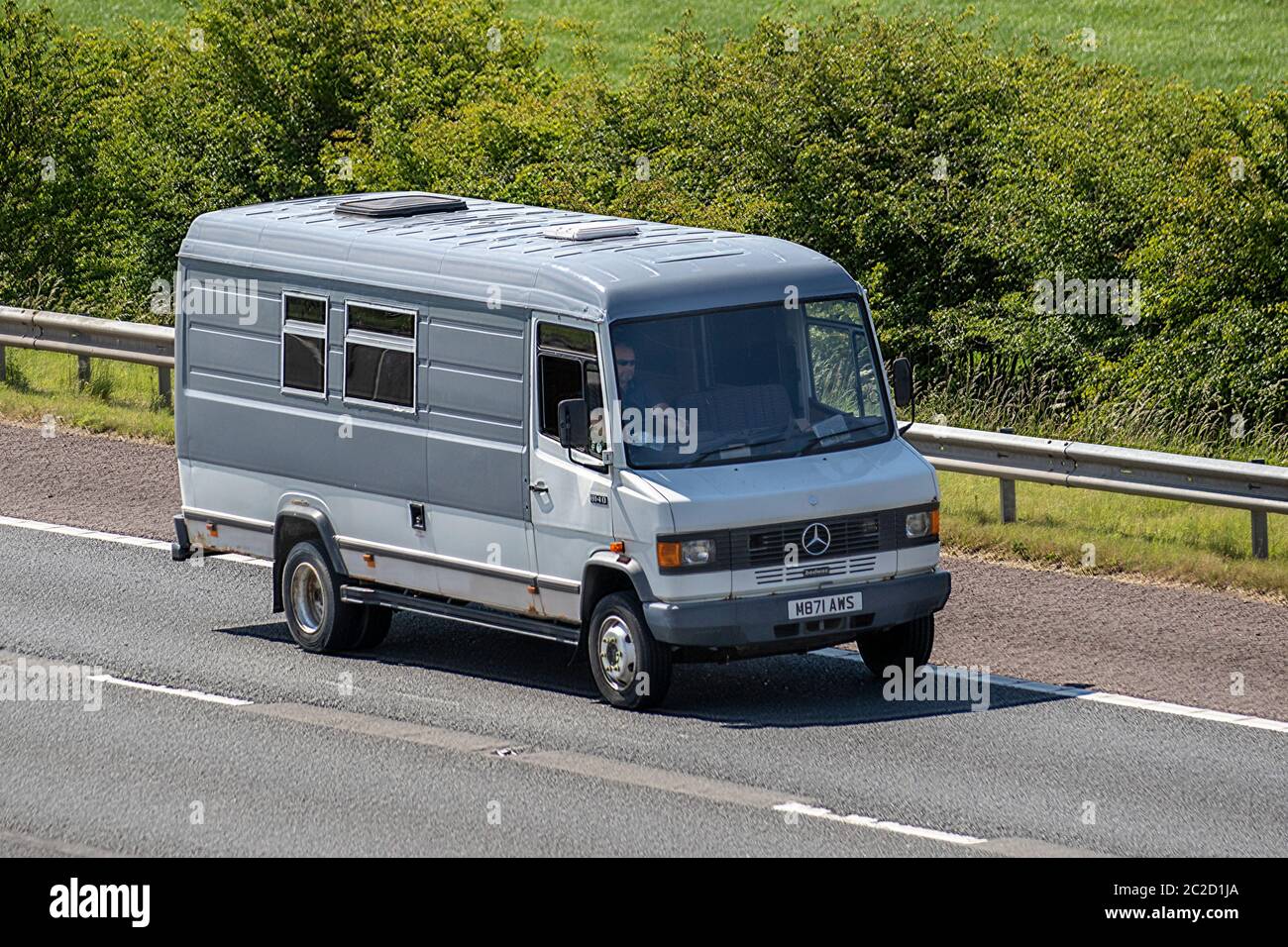1994 Mercedes-Benz Bremer Transporter T1; Vehicular traffic moving  vehicles, cars driving vehicle on UK roads, motors, motoring on the M6  motorway. Touring Caravans and Motorhomes, campervans, RV leisure vehicle,  family holidays, caravanette