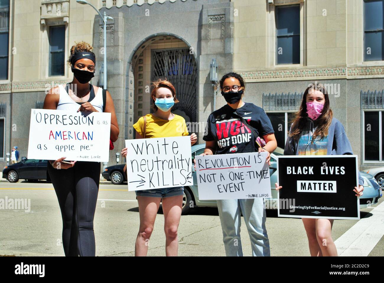 Group walking people holding signs hi-res stock photography and images ...