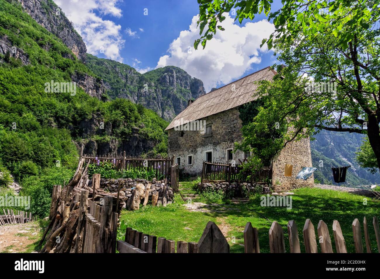 Old stone house in Valbona Valley with the Albanian Alps rising in the background, Albania Stock