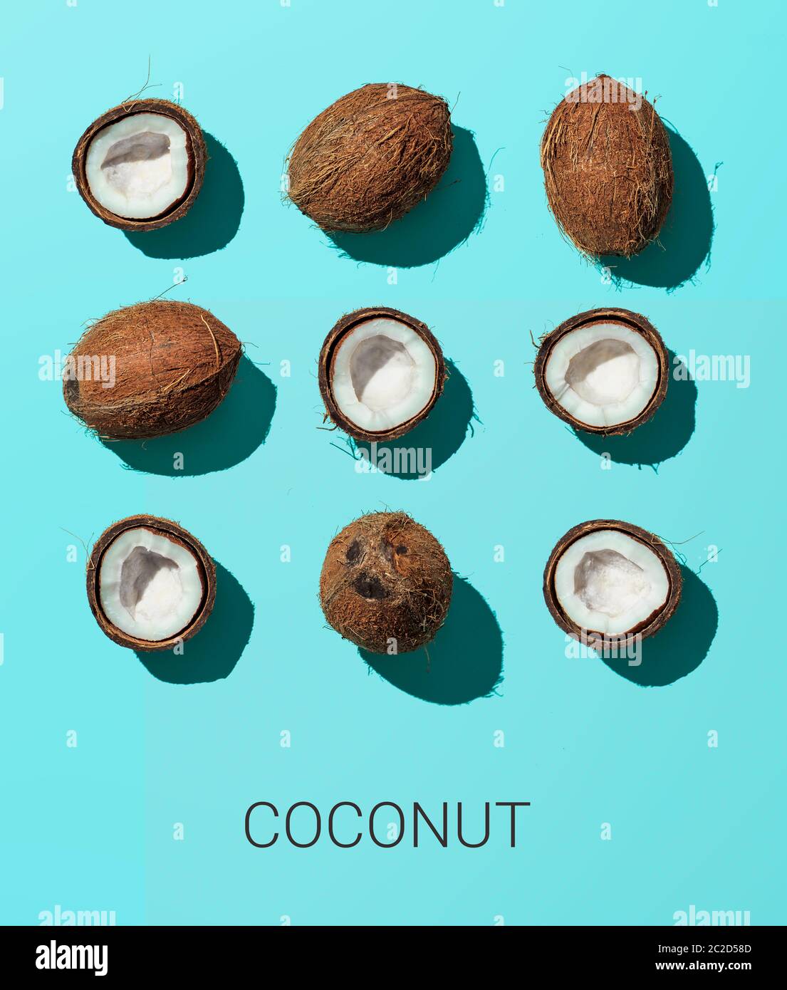 Coconuts on blue background, top view Stock Photo