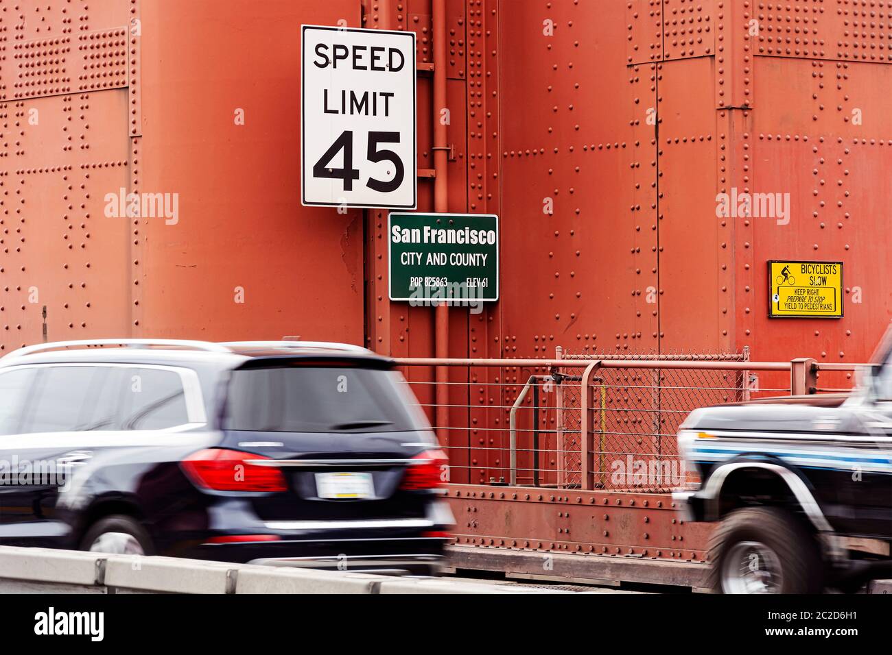 Traffic signs about speed limits and information panels on a tower of the Golden Gate Bridge in San Francisco. Entrance and information on the populat Stock Photo