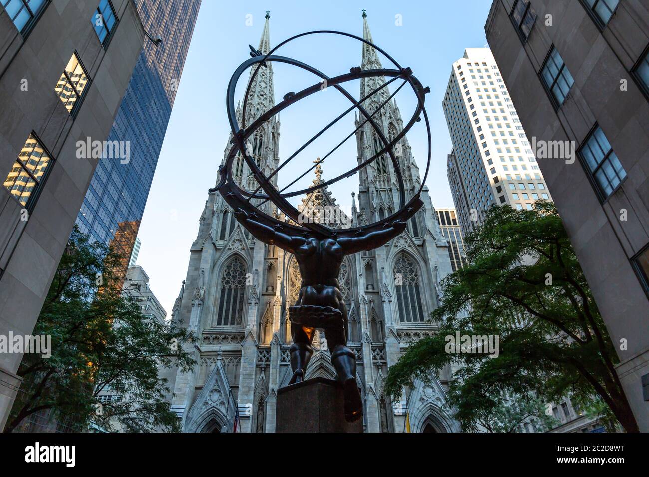 New York City / USA - JUL 19 2018: St. Patrick's Cathedral and Statue of Atlas, a companion piece to Prometheus, outside the Roc Stock Photo