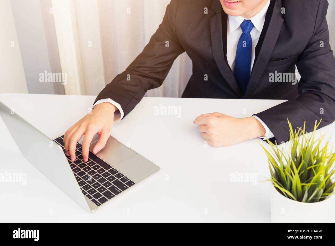 Work from home, Asian young businessman smile wearing headphones and