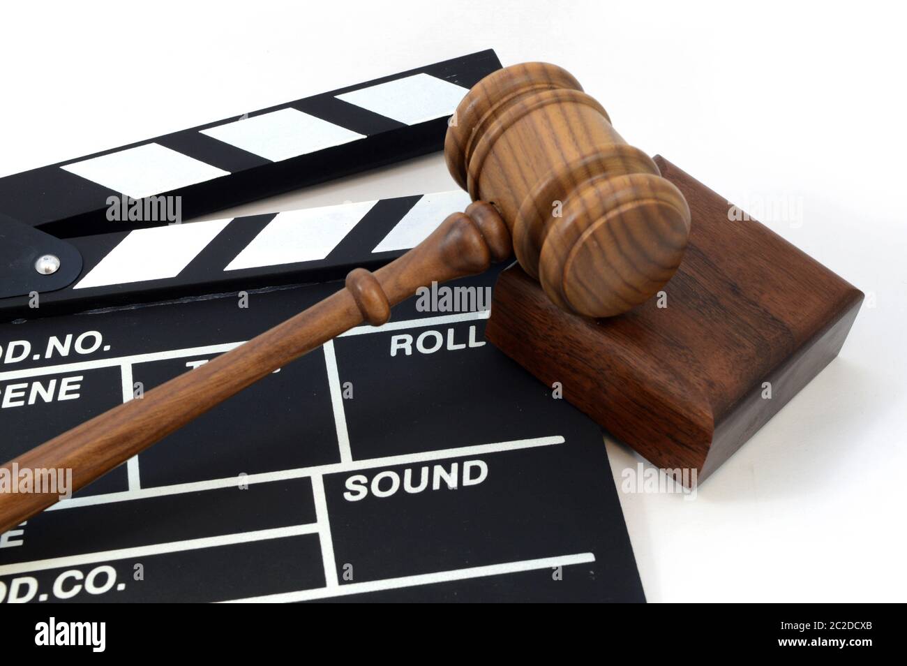 A clapboard and gavel for concepts related to movie production laws and