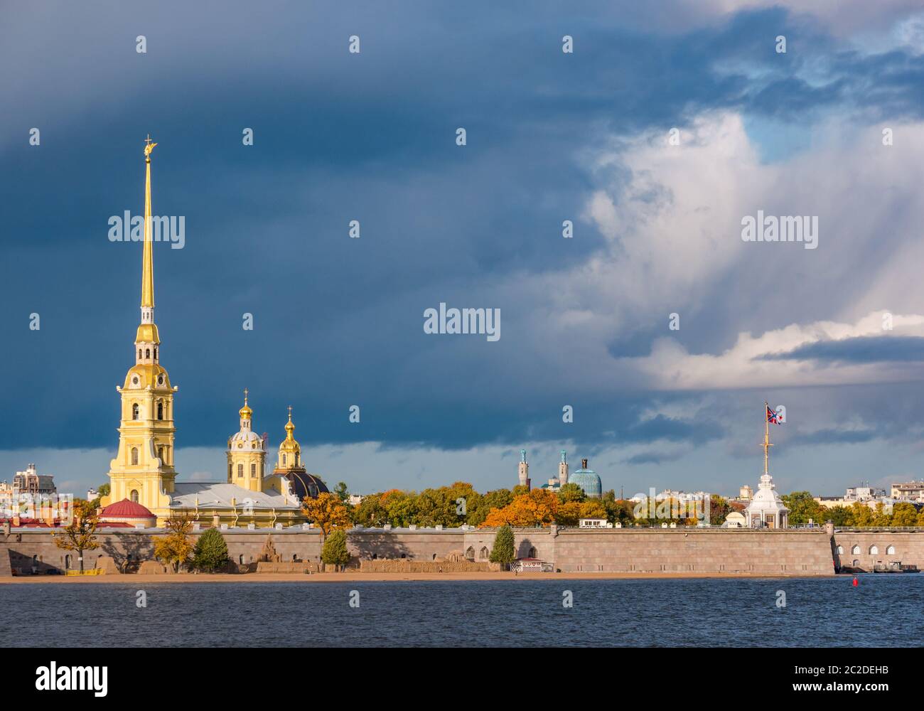 Peter and Paul Cathedral spire, Peter and Paul Fortress on Neva River with stormy sky, St Petersburg, Russia Stock Photo