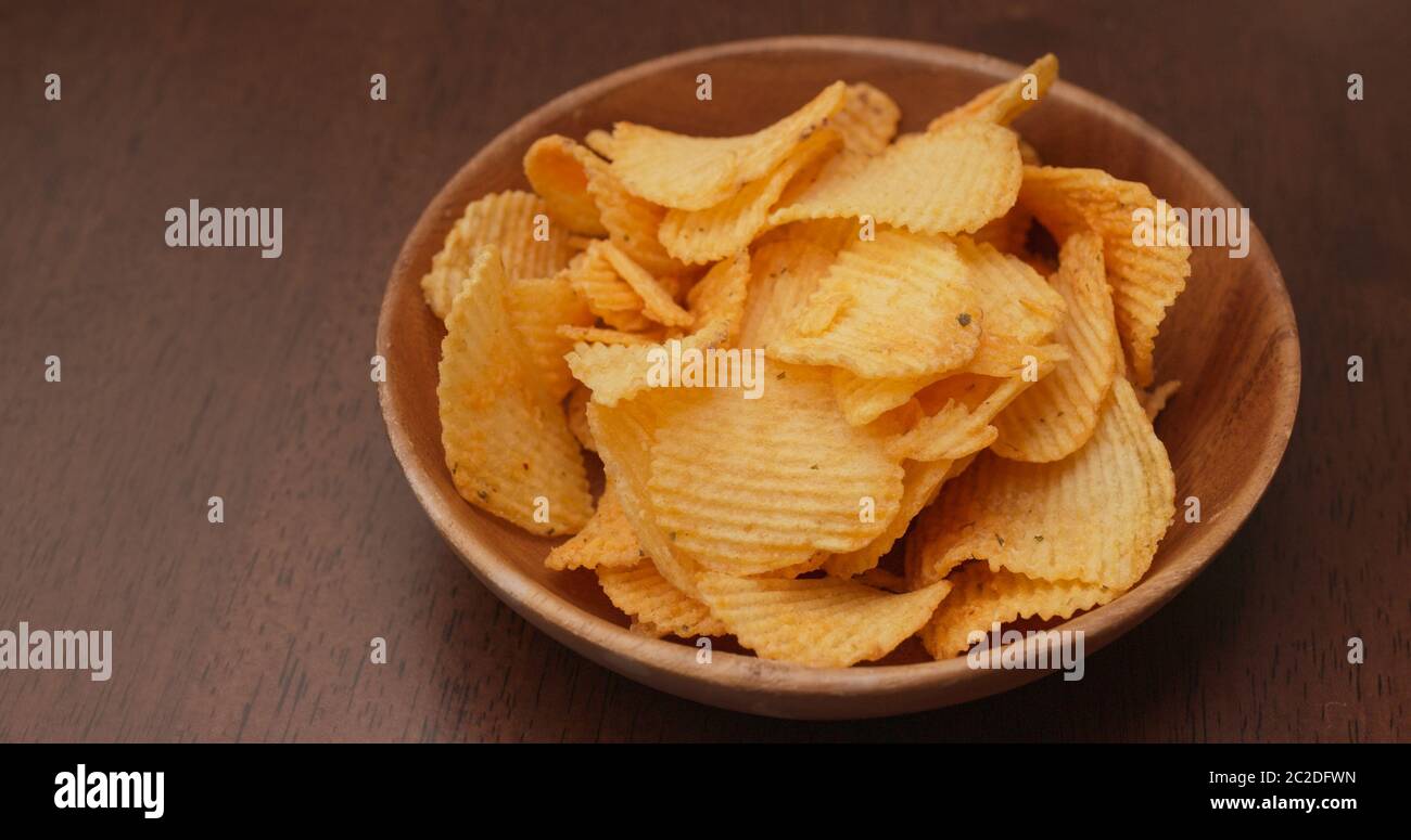 Eat potato chip in the party Stock Photo Alamy