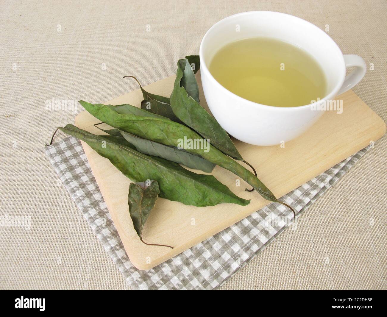 A Cup of avocado leaf tea, tea with dried avocado leaves Stock Photo