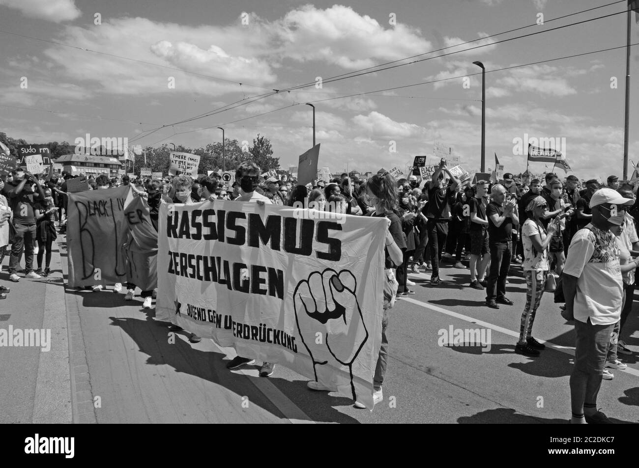 A huge demonstration of young, coloured, black and white people protesting against rassism and police brutality in Zürich City in times of Covid-19 Co Stock Photo