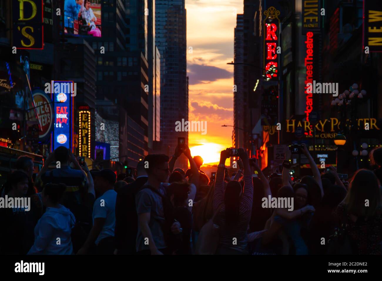 New York City / USA - JUL 13 2018: Manhttanhenge street view from Times Square at rush hour in midtown Manhattan Stock Photo