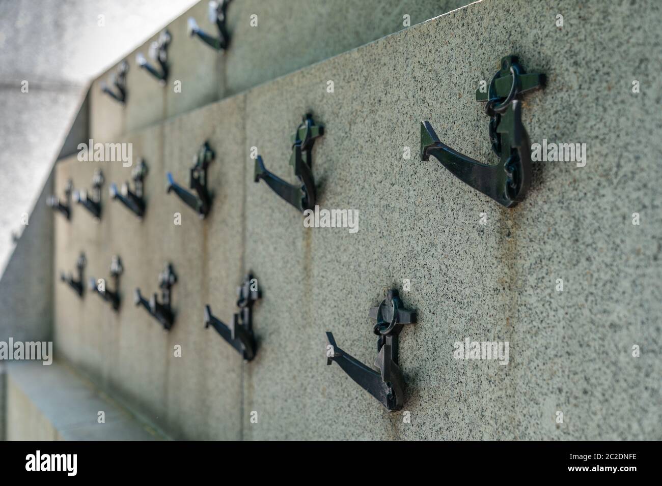 The National Submariners' War Memorial attached to the Embankment, London adorned with minature weathered cast iron anchors 1 Stock Photo